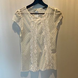 Delicate lace top with cap sleeves.